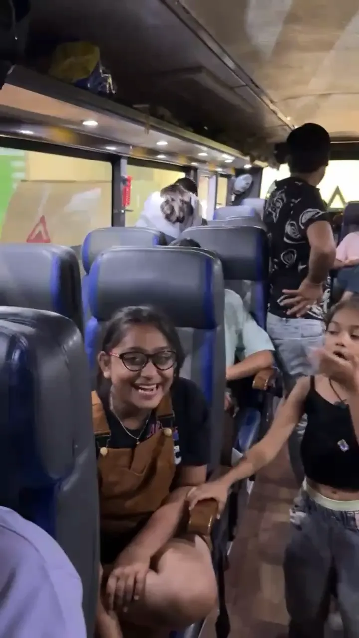 Video: our guests, children and adults, singing and dancing in the aisle of the tour coach