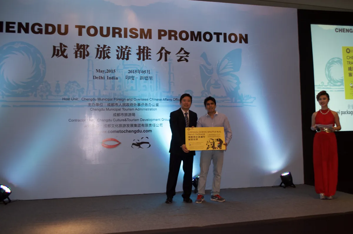 Zen Vibe Holidays receiving a Chengdu travel package award on stage at the Chengdu Tourism Promotion in Delhi, May 2015
